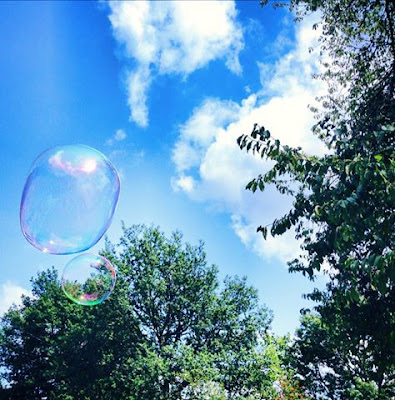 Summer days in the garden at De Tout Coeur Limousin - blowing bubbles  