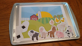 Magnetic animals and matching scene on baking sheet