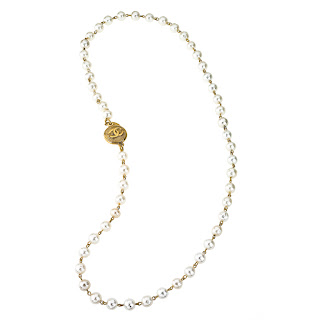 Vintage 1990's long Chanel pearl necklace with gold coin shaped closure.