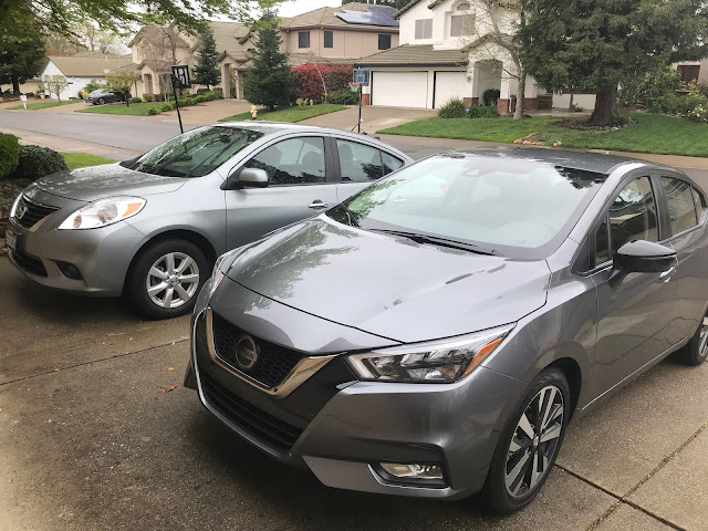 Front 3/4 view of 2013 and 2020 Nissan Versa