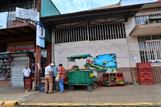 mural on building, vegetable stand on sidewalk in Puriscal, Costa Rica