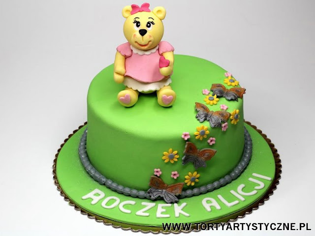 tort na roczek " title="tort na urodziny z misiem" /></a></div><H4>Tort na Roczek w Poznaniu z figurką Misia</H4>
<div style=