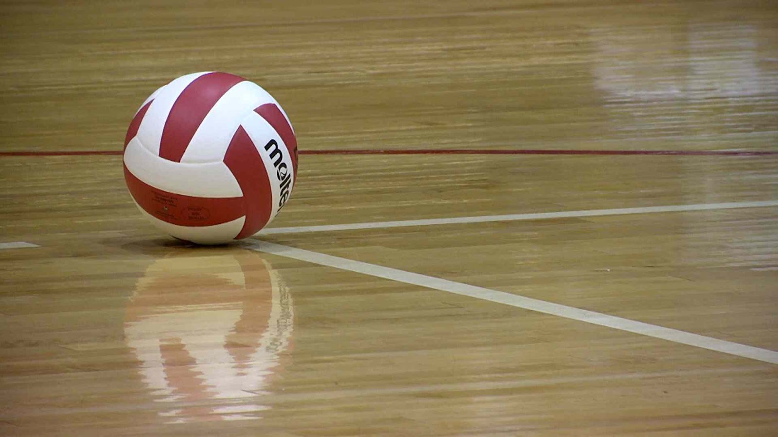 volleyball on wood gym floor