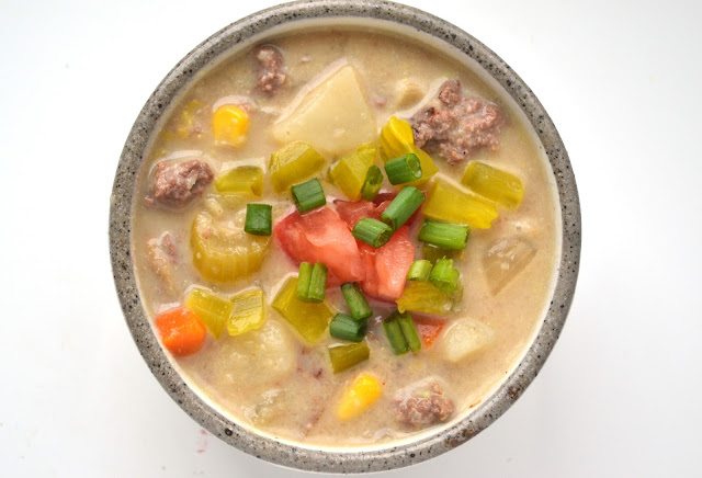 This cheeseburger soup tastes just like your favorite burger! It is a lightened up version yet tastes rich and creamy! www.nutritionistreviews.com