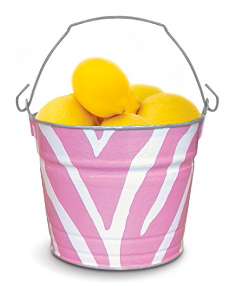 pink and white bucket filled with lemons