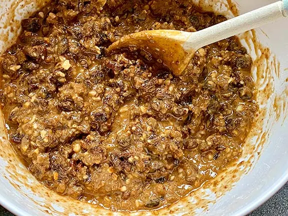 Fruit cake mixture in a bowl.