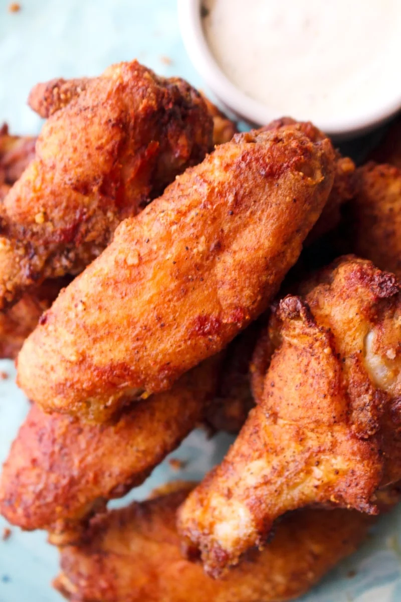 Air Fryer Breaded Chicken Wings on a blue plate.