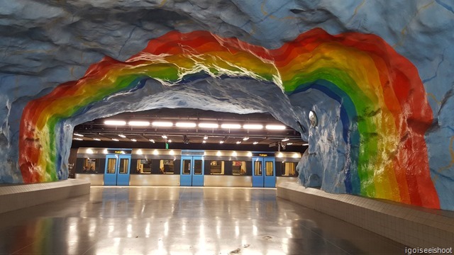 Stadion Station's artwork of rainbow on blue skies.