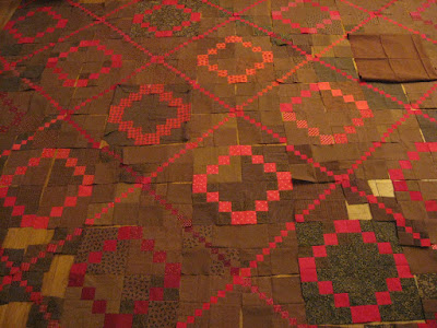 Red and brown double and triple four-patch quilt blocks