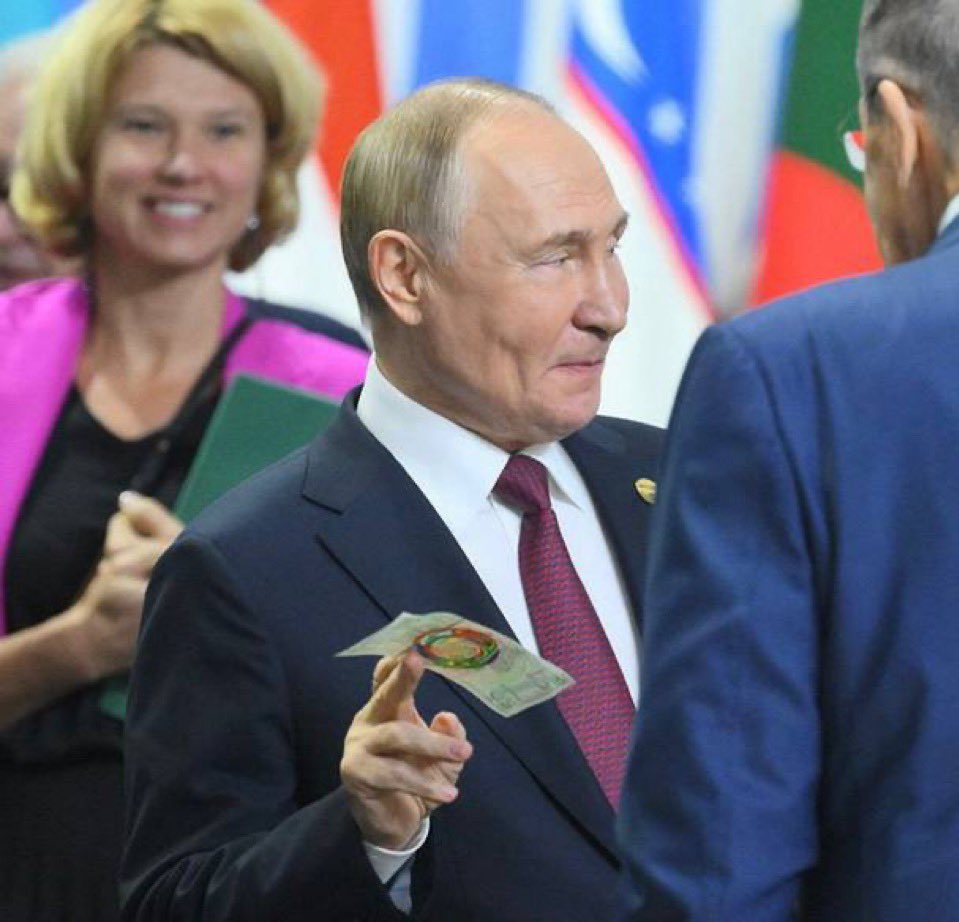 President of Russia, Vladimir Putin, displays the new BRICS currency at the BRICS Summit 2024 in Kazan, Russia