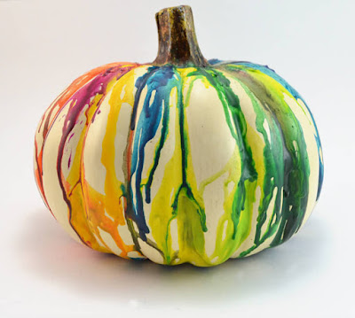 http://www.dreamalittlebigger.com/post/melted-crayon-pumpkin-craft.html 