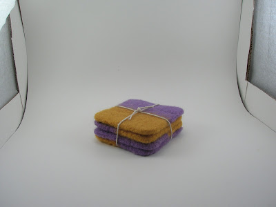 dark photo of felted coasters showing lightbox