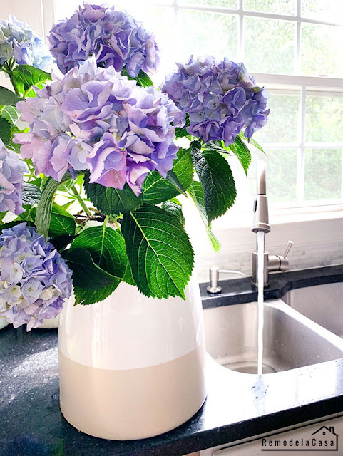 purple hydrangeas close to the sink