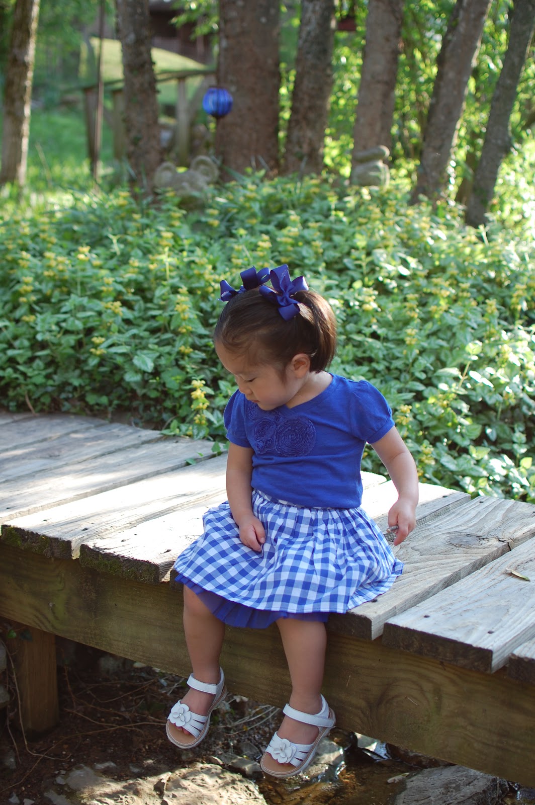 they have built three little bridges crossing over a creek in their backyard