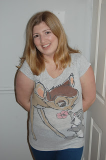 Meagan wearing a grey t shirt with a sketch of Bambi and Thumper from Disney's Bambi on it