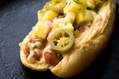 mexican hot dog with chipotle mayonnaise and pineapple salsa