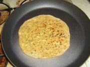 Paneer paratha during roasting