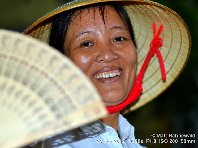 Asian conical hat, conical straw hat, Vietnamese style conical hat, nón lá, sedge hat, rice hat, paddy hat, Vietnamese woman, portrait, headshot, Vietnam, Hanoi