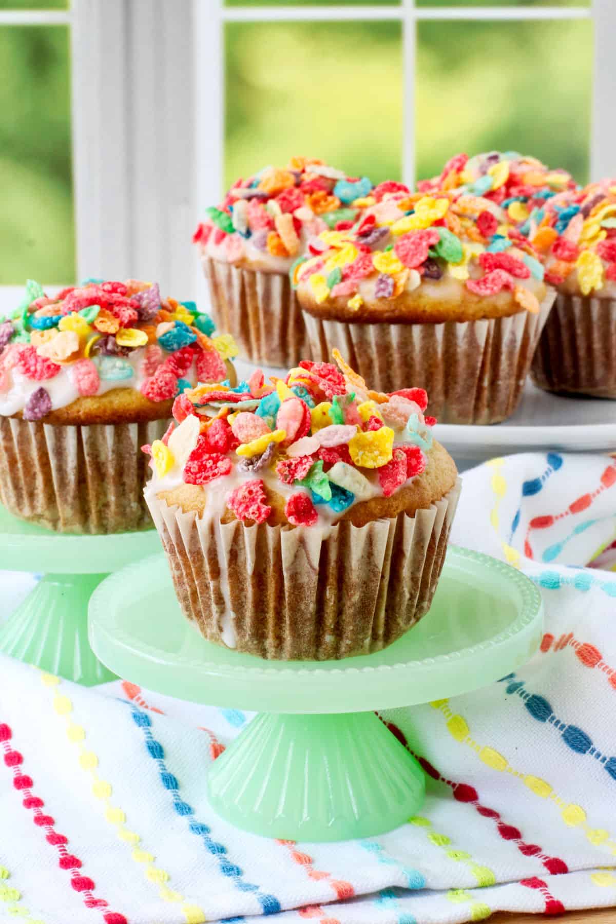 Cereal Milk Muffins on individual green cake stands.