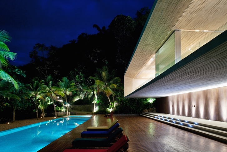 Terrace of Modern beach house in Brazil by Marcio Kogan  at night 