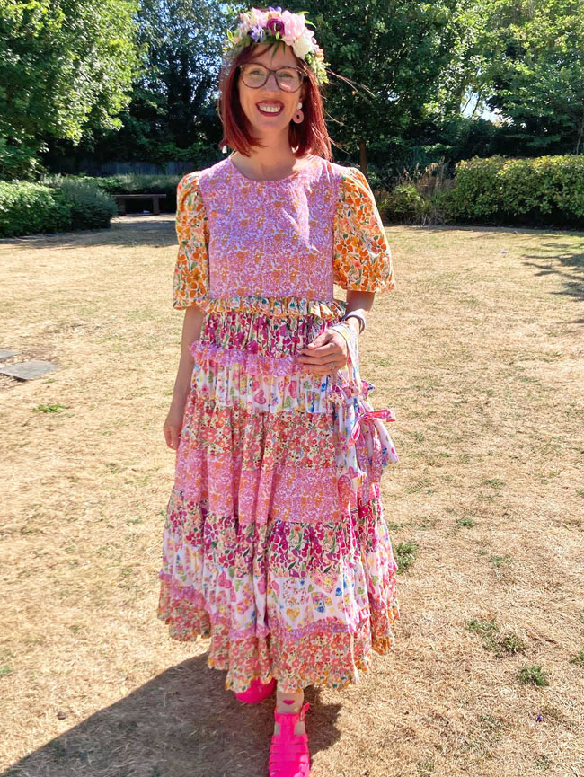 Liz wears a full length Indigo smock made up of various floral cotton prints