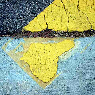 A yellow crosswalk line (c) David Ocker