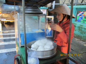 Local speciality of Hue. A steamed rice puff with meat and vegetables stuffed inside.