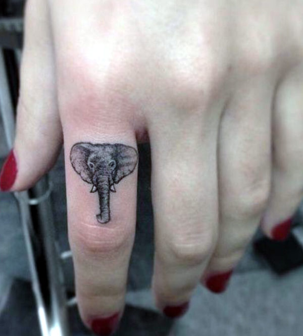 The small elephant head tattoo design black and grey work great idea for inspiration that look beautiful on your finger