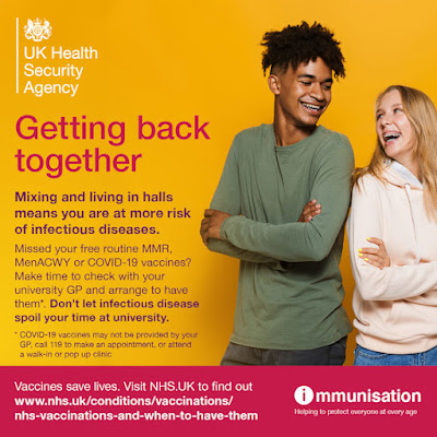 Young people off to uni get vaccinated photo of two hip young folk grinning at each other. His luck is in.
