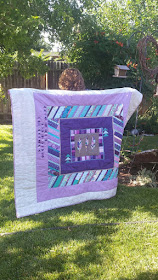 Aqua and purple feather round robin quilt