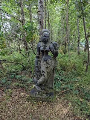 Statue in the forest at Victor's Way on a day trip from Dublin in August