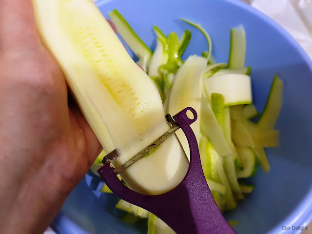 peeling zucchini to strips