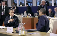 France's President Nicolas Sarkozy gestures towards President Obama during the G20 Summit November 3, 2011.