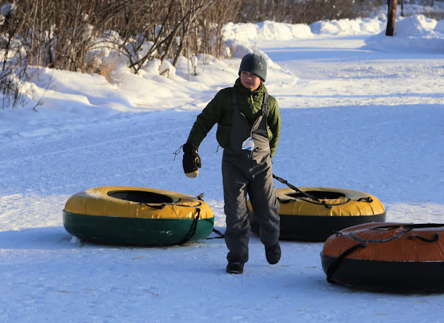 Frank pulling his snow tube