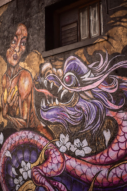 African-American woman purple dragon graffit