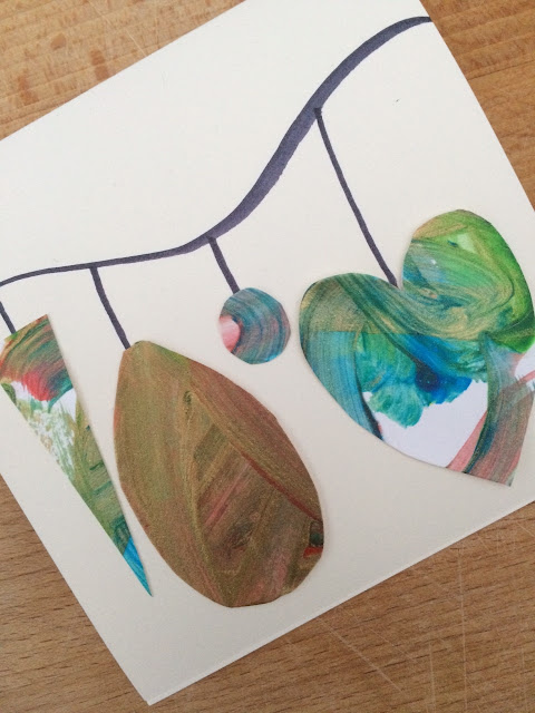 Hand made card with bauble shapes glued to it