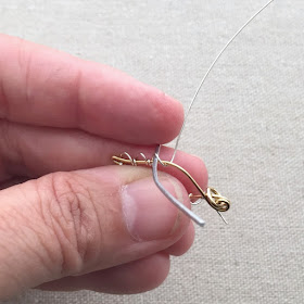 Learn to make this wire leaf with scallop edge - from a free tutorial at Lisa Yang's Jewelry Blog