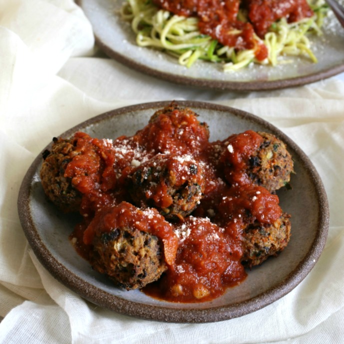 Recipe for sauteed zucchini noodles with vegetable meatballs and tomato sauce.