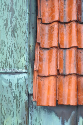 roof tiles and metal sheeting in the rain