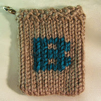 the letter B rendered in knitting