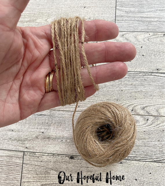 hand with jute twine wrapped around fingers