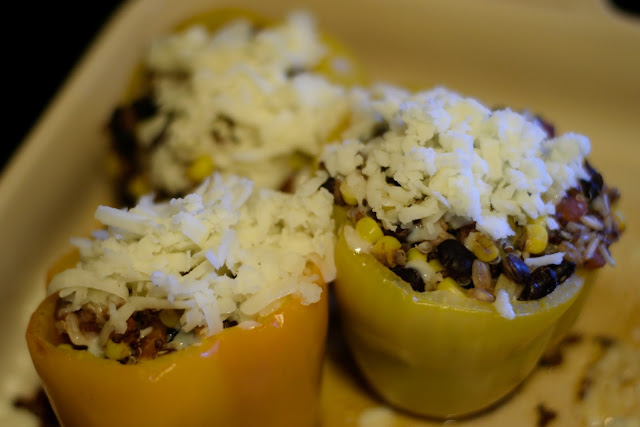 The bell peppers with cheese on top. 