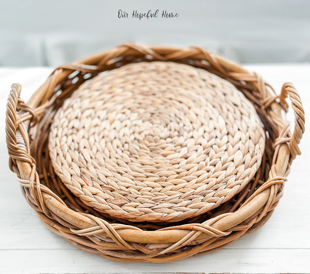 round rattan tray filled with seagrass placemats