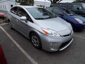 2012 Prius with delaminating or peeling paint on the front bumper after repair at Almost Everything Auto Body.