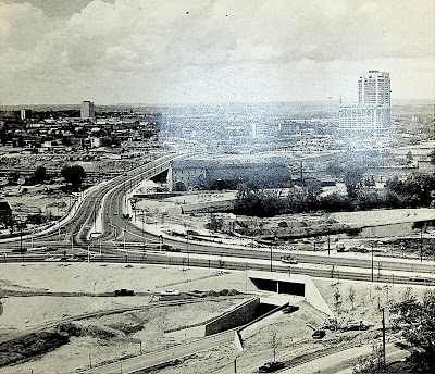 Photo taken from Christ Church Cathedral Hill looking north along the Portage Bridge with landscaping works still underway around the two layers of tunnel running along the original Wellington Street ramp, what is now Cliff Street.