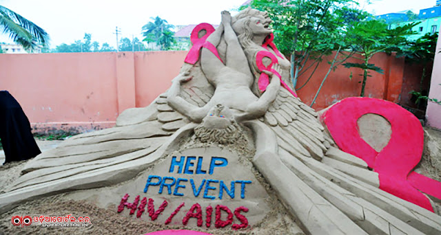 World AIDS Day 2015: Sand Sculpture by Manas Kumar Sahoo at Golden Sea Beach, Puri