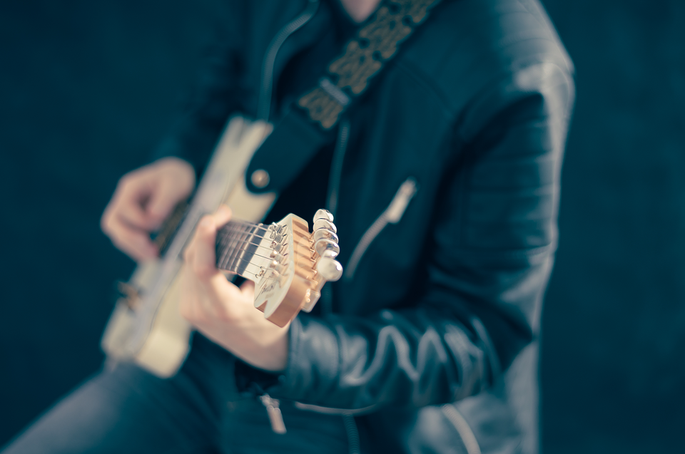 Elegant man playing the guitar