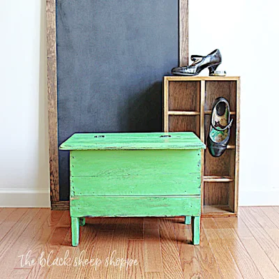 Antique shoe shine box painted bright green.