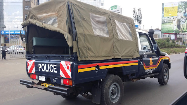 The National Police Service vehicle with Police officer who forced into public car