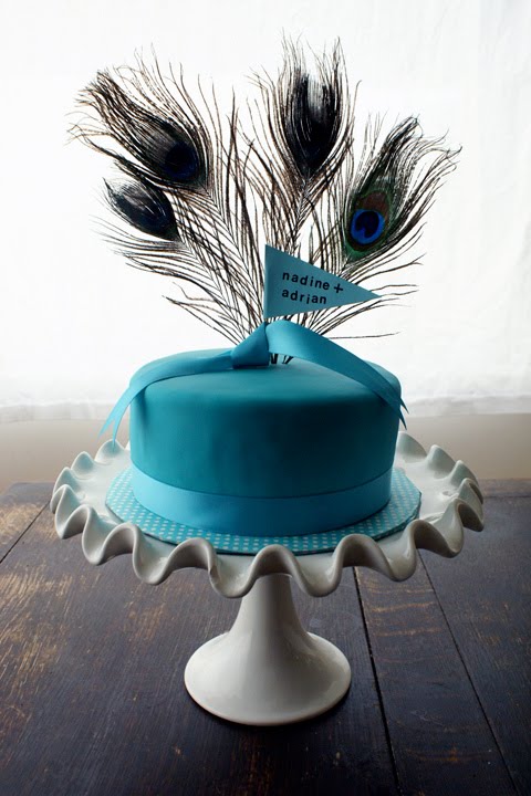 While cruising around I found Coco Cupcake's Peacock themed wedding cake on